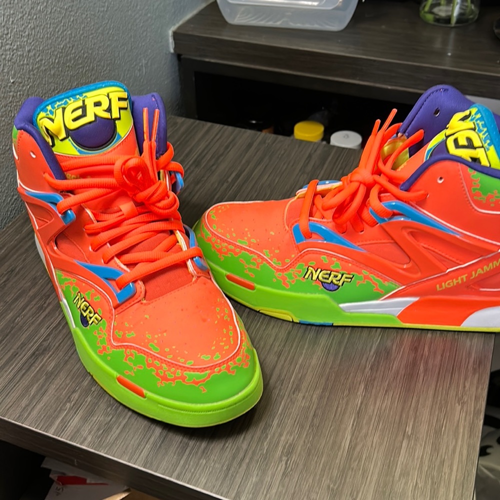 Reebok, Nerf pump shoes colors are orange, lime, green blue and purple.